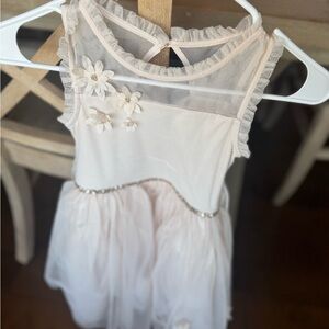 Elegant Cream Sleeveless Dress with Floral Accents